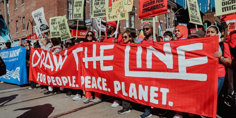 Global Climate Marches Call Out Banks as Canadian ‘Draw the Line’ Rallies Challenge Carney’s Agenda
